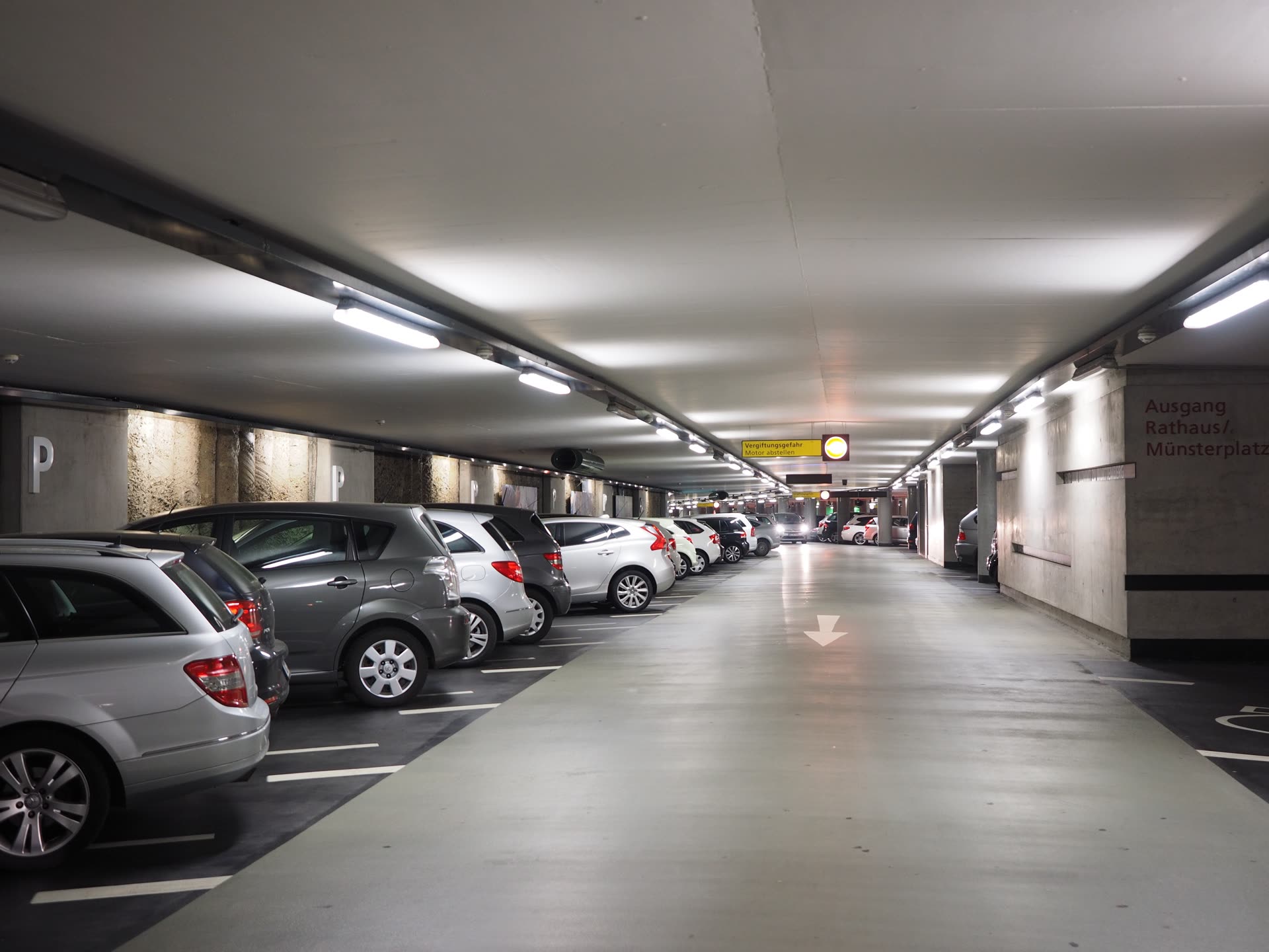 UAE residential building basement parking level, cars in bays